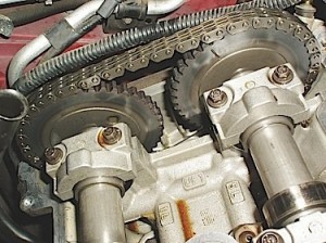In contrast to the first photo, this timing chain-type Mazda engine is equipped with a coil-on plug ignition, a remotely located water pump and a single serpentine belt accessory drive.