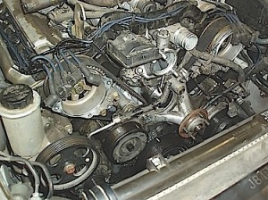 In this photo, the complete secondary ignition on this 1995 Toyota is being replaces as well as all accessory belts, hoses and tensioner pulleys.